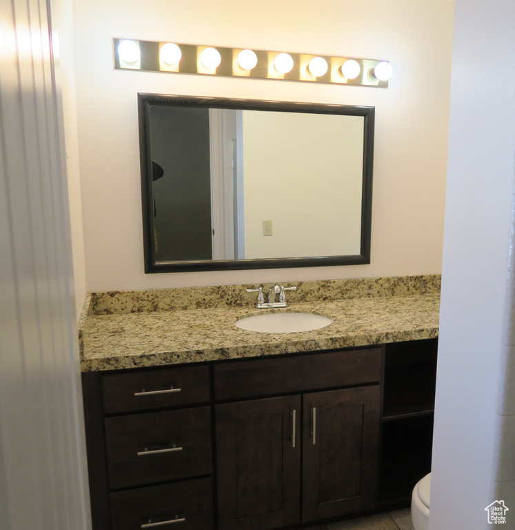 Bathroom with vanity and toilet