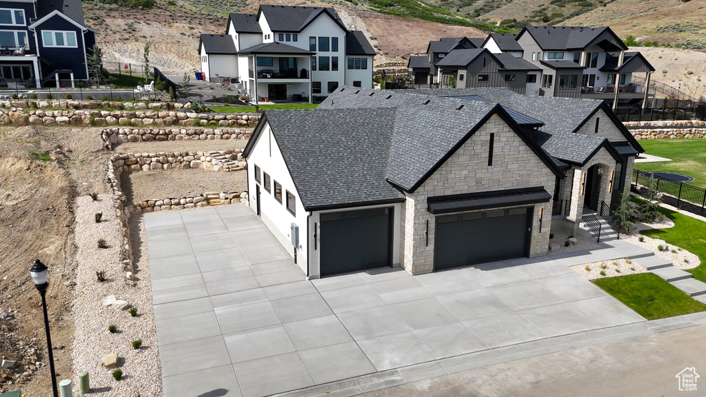Aerial view of residential area featuring mountains