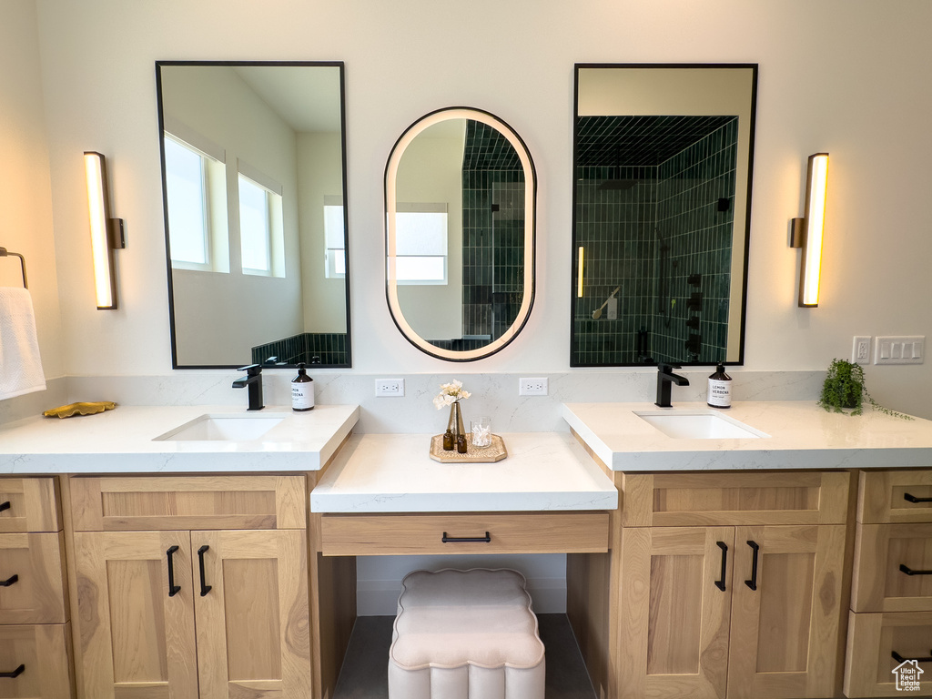 Bathroom featuring two vanities