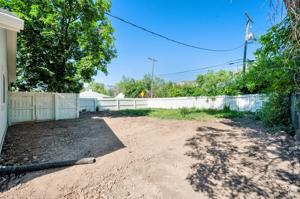View of fenced backyard