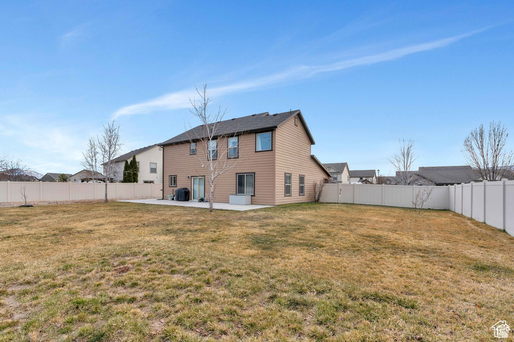 Rear view of house with a patio area