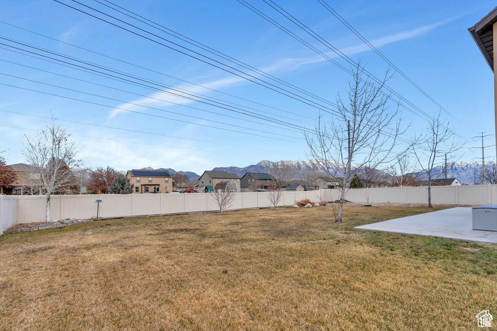 View of yard featuring a patio area and a residential view