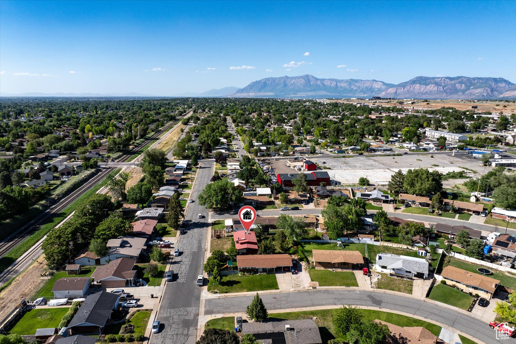 Aerial perspective of suburban area featuring a mountain backdrop