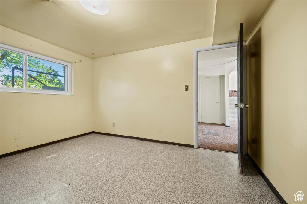 Unfurnished room featuring baseboards