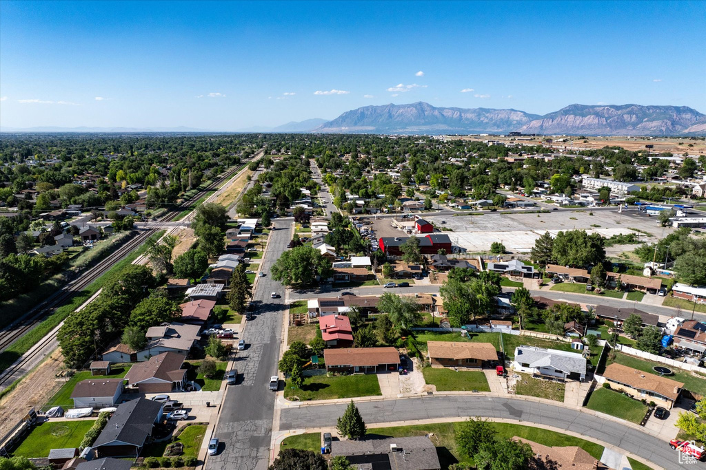 Aerial perspective of suburban area featuring a mountain backdrop