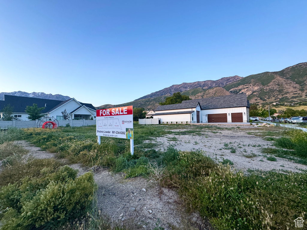 Exterior view of mountains and dirt driveway