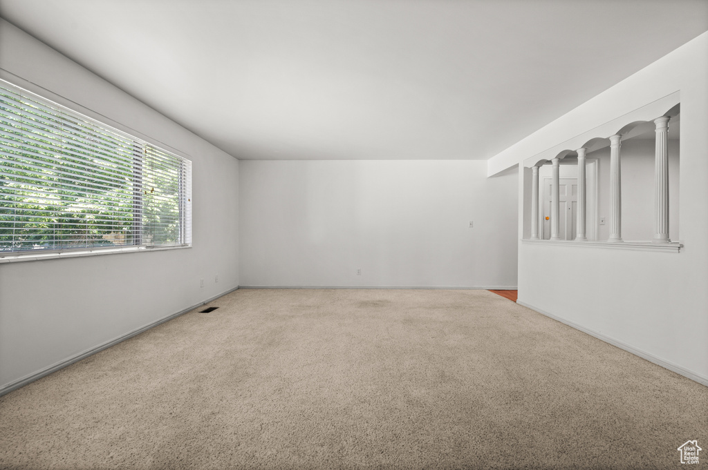 Unfurnished room with carpet floors