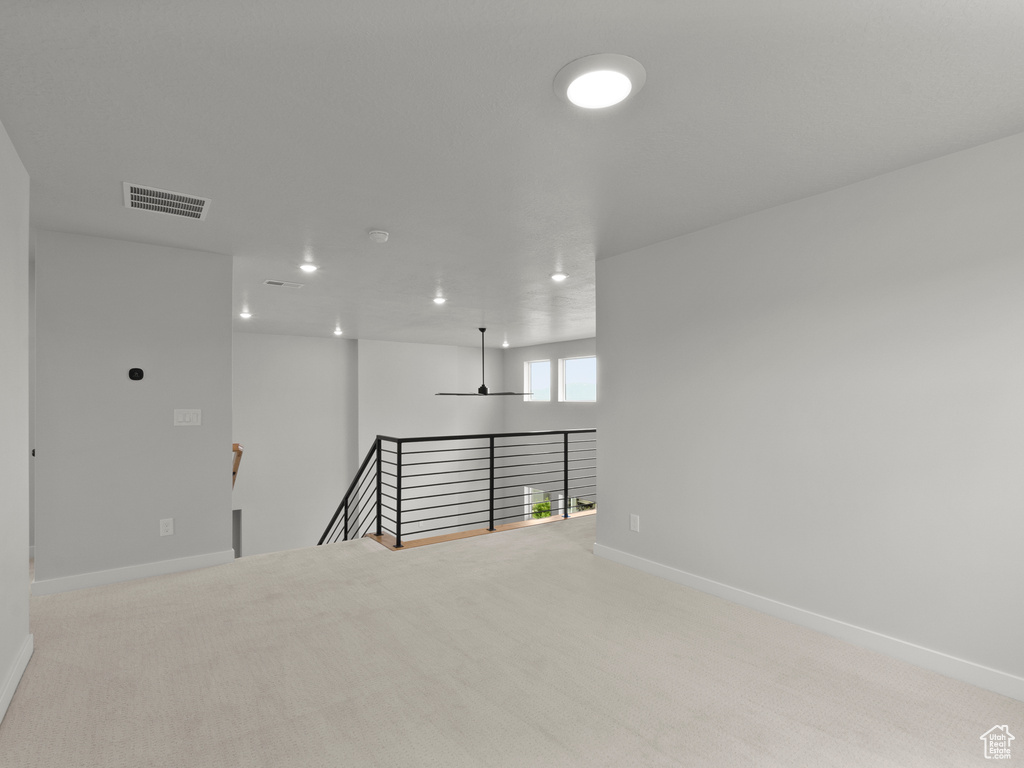 Spare room featuring carpet and recessed lighting