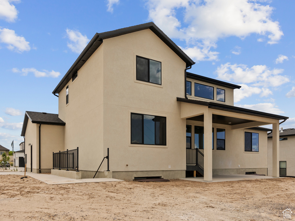 Back of property with stucco siding