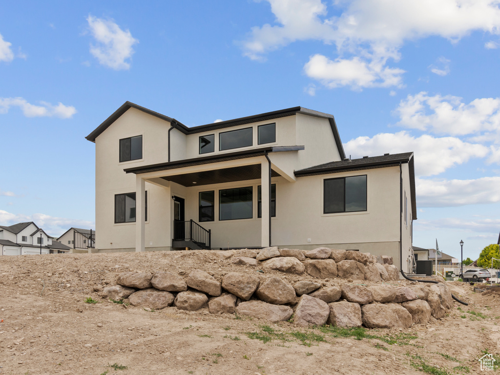 View of front of house featuring stucco siding