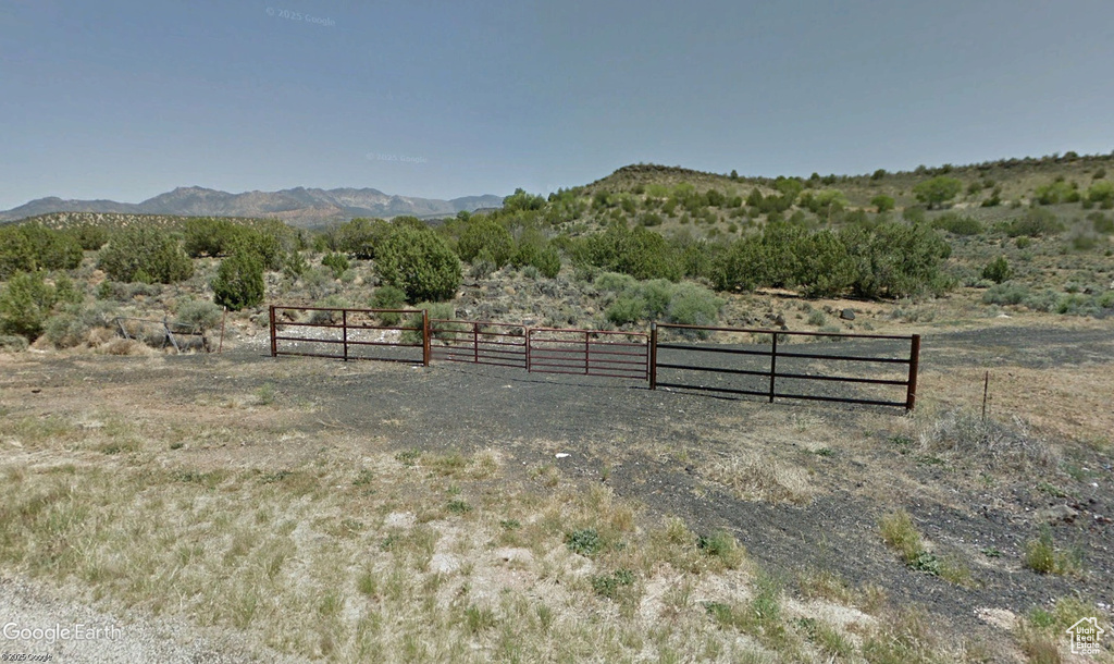 View of yard with a view of countryside and a mountain view