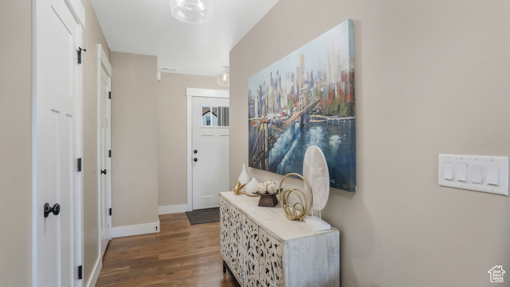 Foyer featuring wood finished floors and baseboards