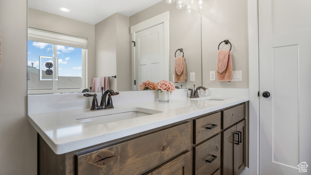 Full bath featuring double vanity