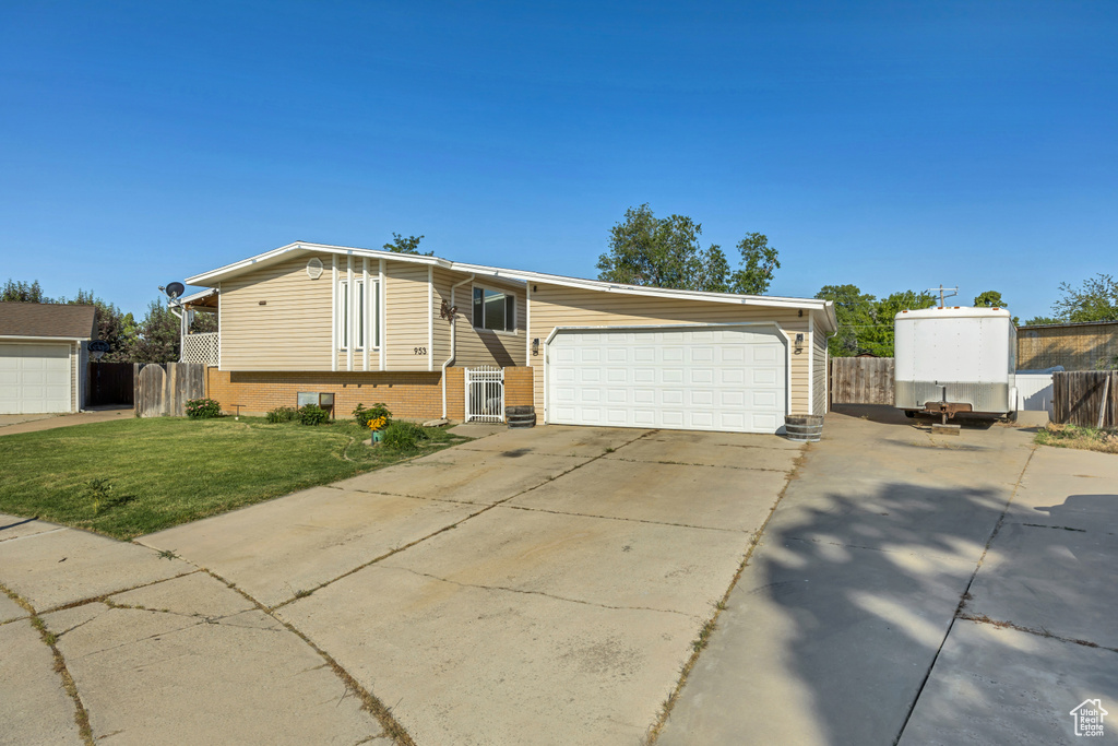 View of front facade with brick siding and concrete driveway