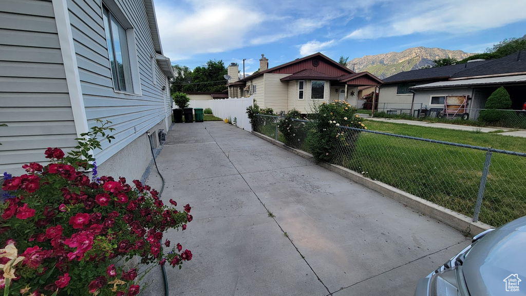 View of patio / terrace with a mountain view and concrete driveway