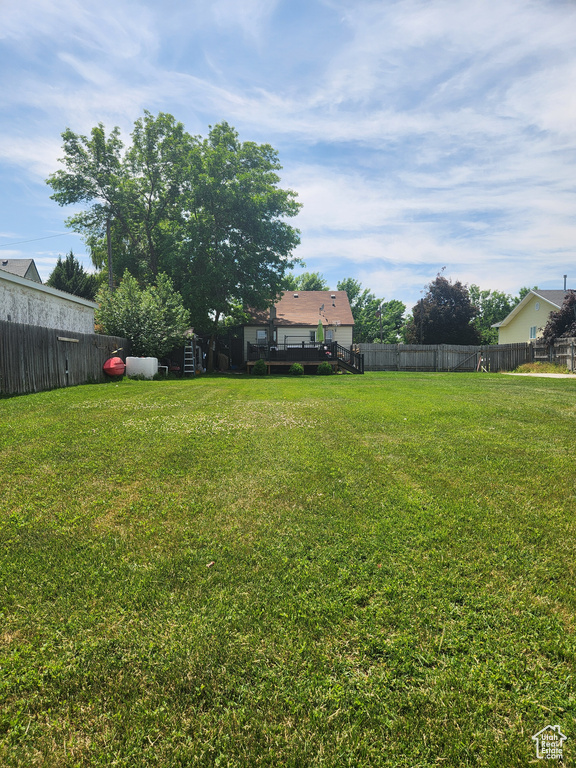 View of yard featuring a wooden deck