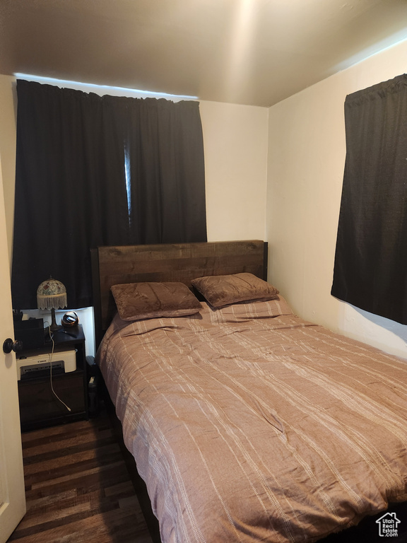 Bedroom with wood finished floors