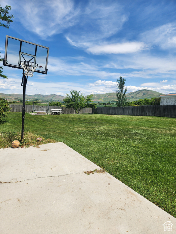 View of yard featuring a mountain view and a patio