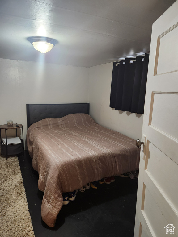 Bedroom featuring concrete flooring