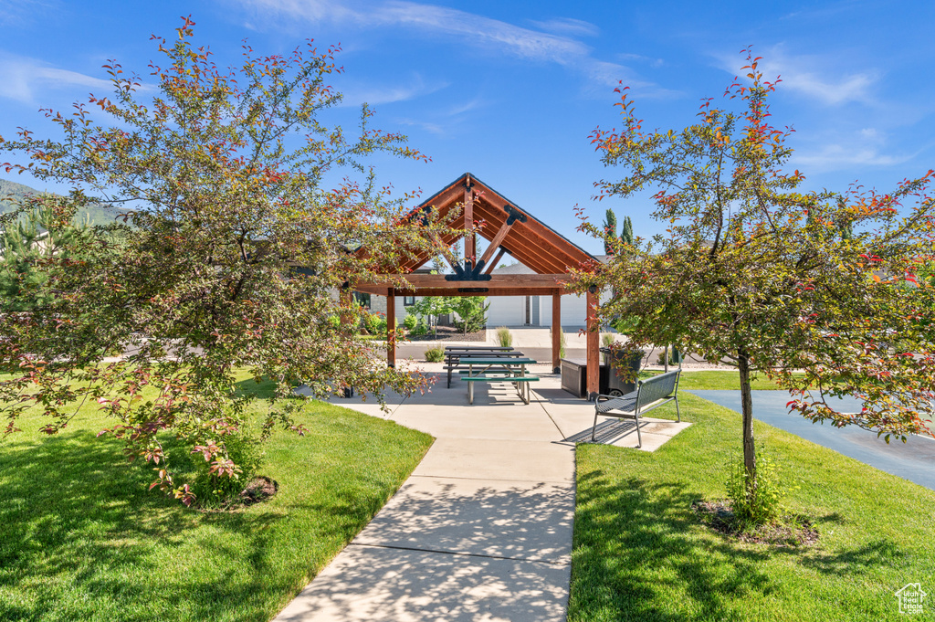 Surrounding community with a gazebo and a lawn