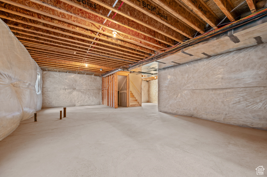 Unfinished basement with stairway