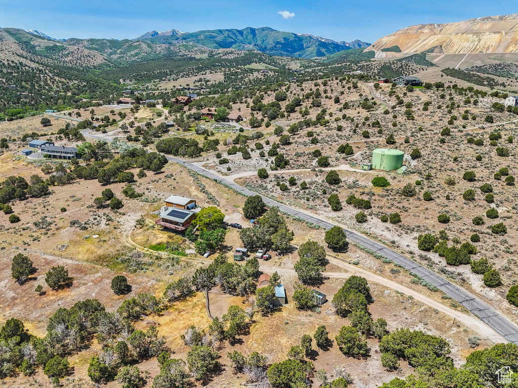 Aerial view of sparsely populated area featuring a desert landscape and a mountain backdrop