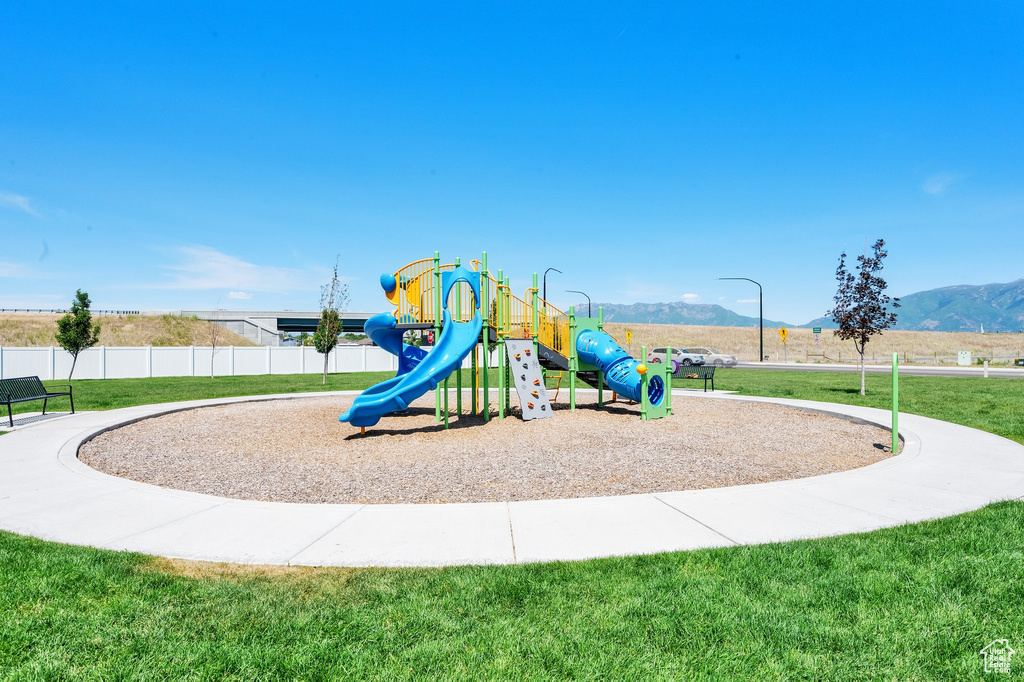 Community playground featuring a mountain view