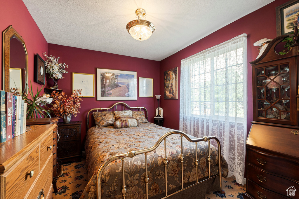 Bedroom featuring a textured ceiling