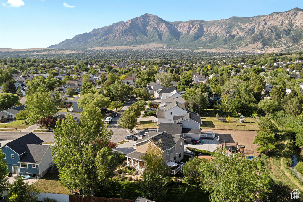 Aerial perspective of suburban area featuring a mountain backdrop