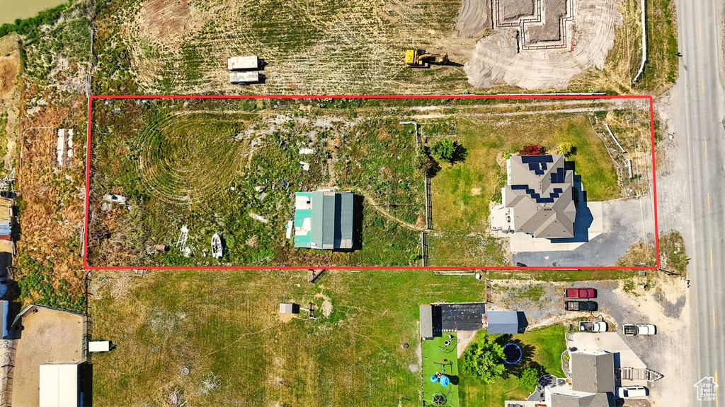 Aerial view of property and surrounding area featuring property boundaries highlighted