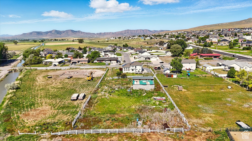 Aerial view of residential area with a mountainous background