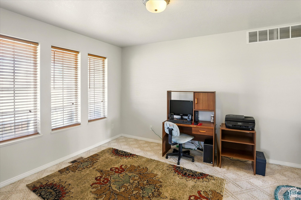 Office area featuring baseboards