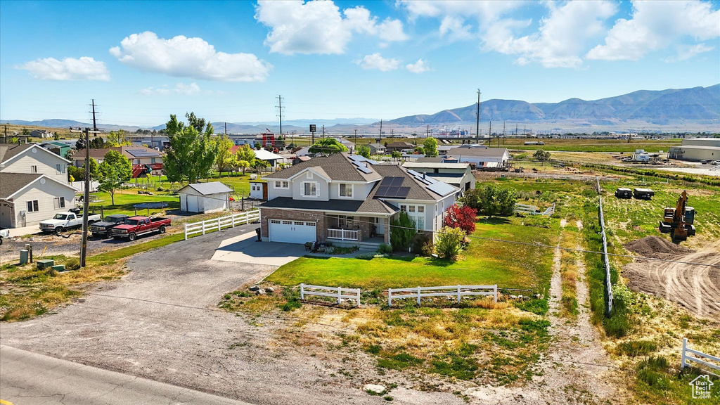 Aerial perspective of suburban area with a mountain backdrop