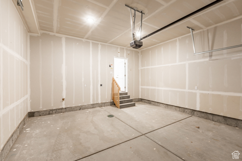 Garage featuring a garage door opener
