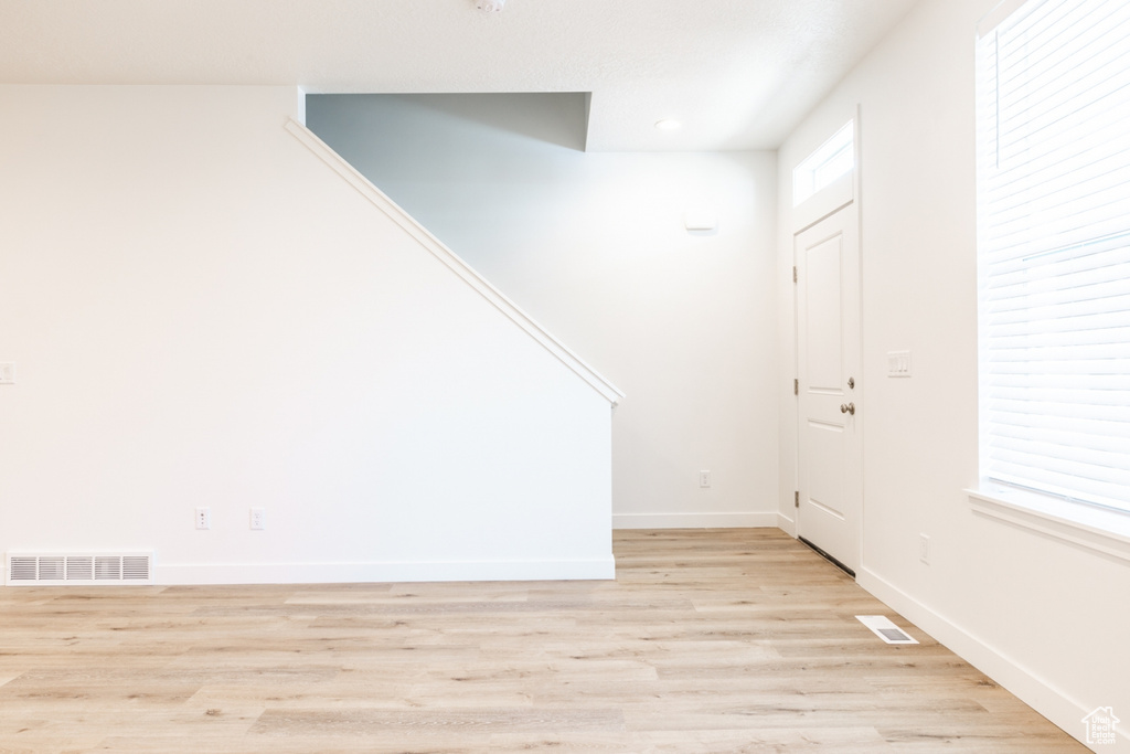 Foyer entrance featuring light hardwood / wood-style flooring