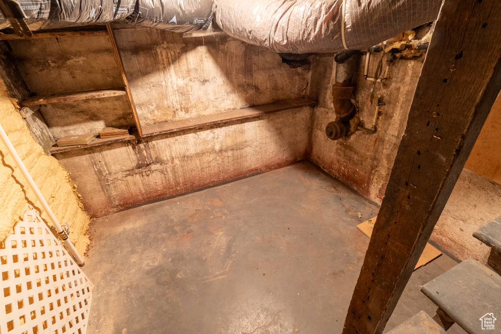 Basement view of unfinished concrete flooring