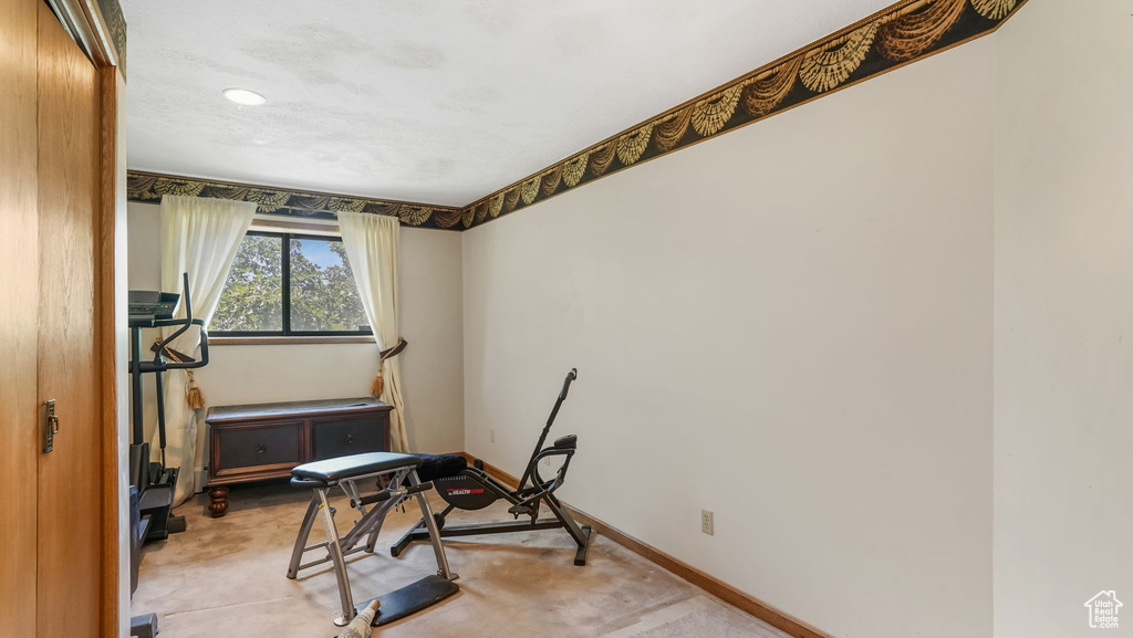 Exercise room featuring baseboards and recessed lighting