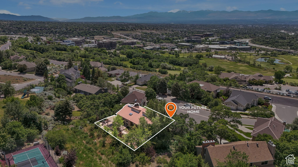 Aerial view of residential area featuring property parcel outlined and a water and mountain view