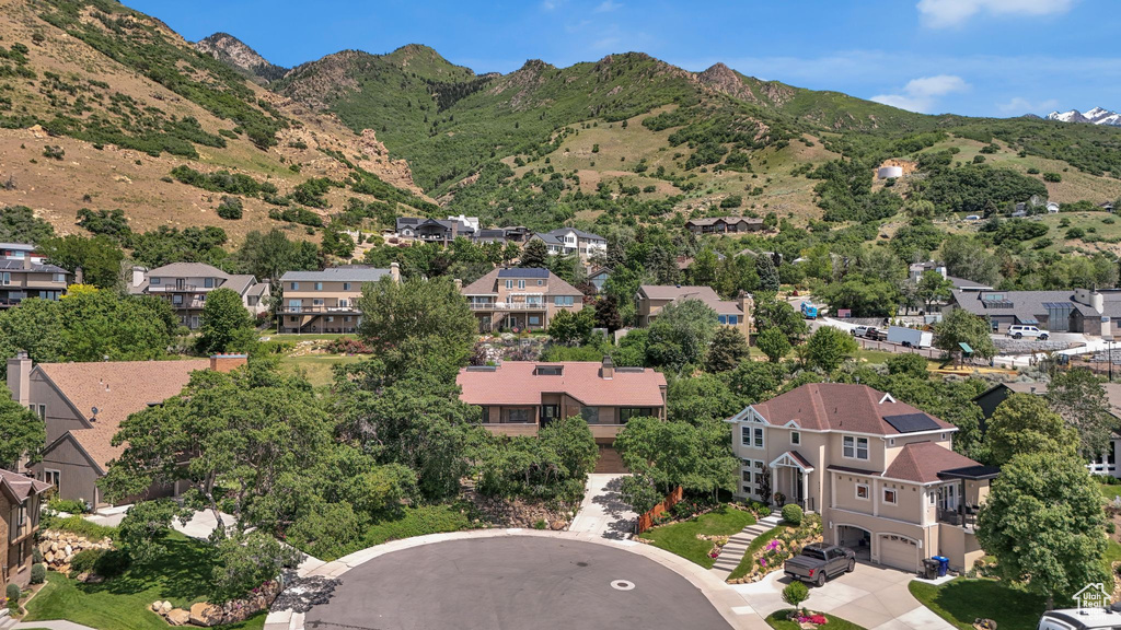 Aerial perspective of suburban area with a mountain backdrop