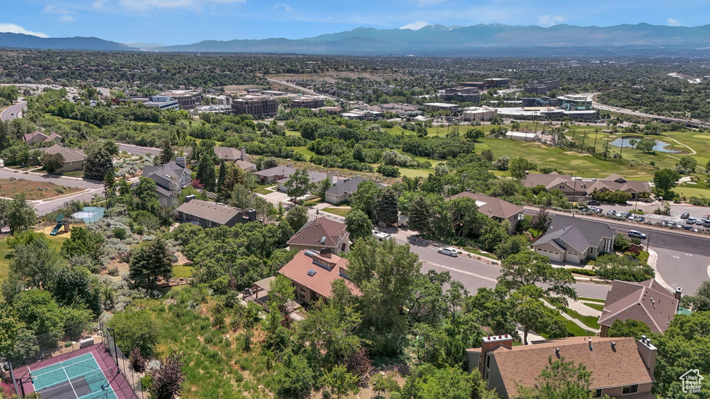 Aerial perspective of suburban area with a water and mountain view
