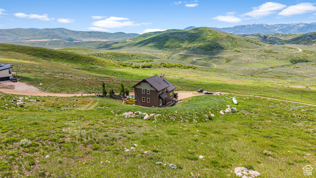 View of mountain background featuring rural landscape