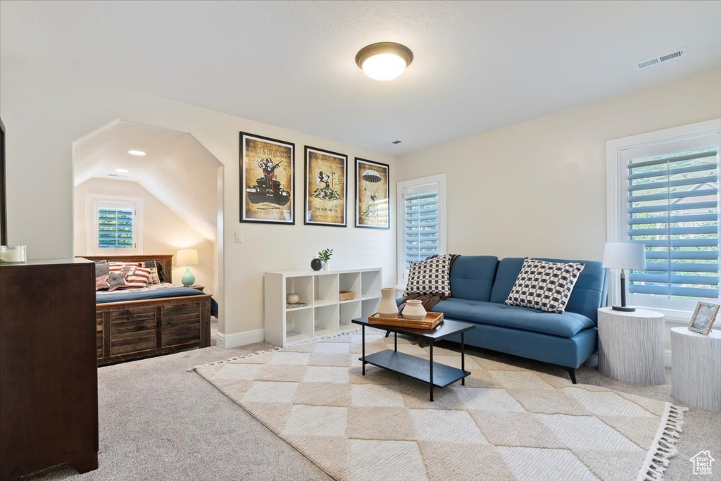 Living room with light carpet and baseboards