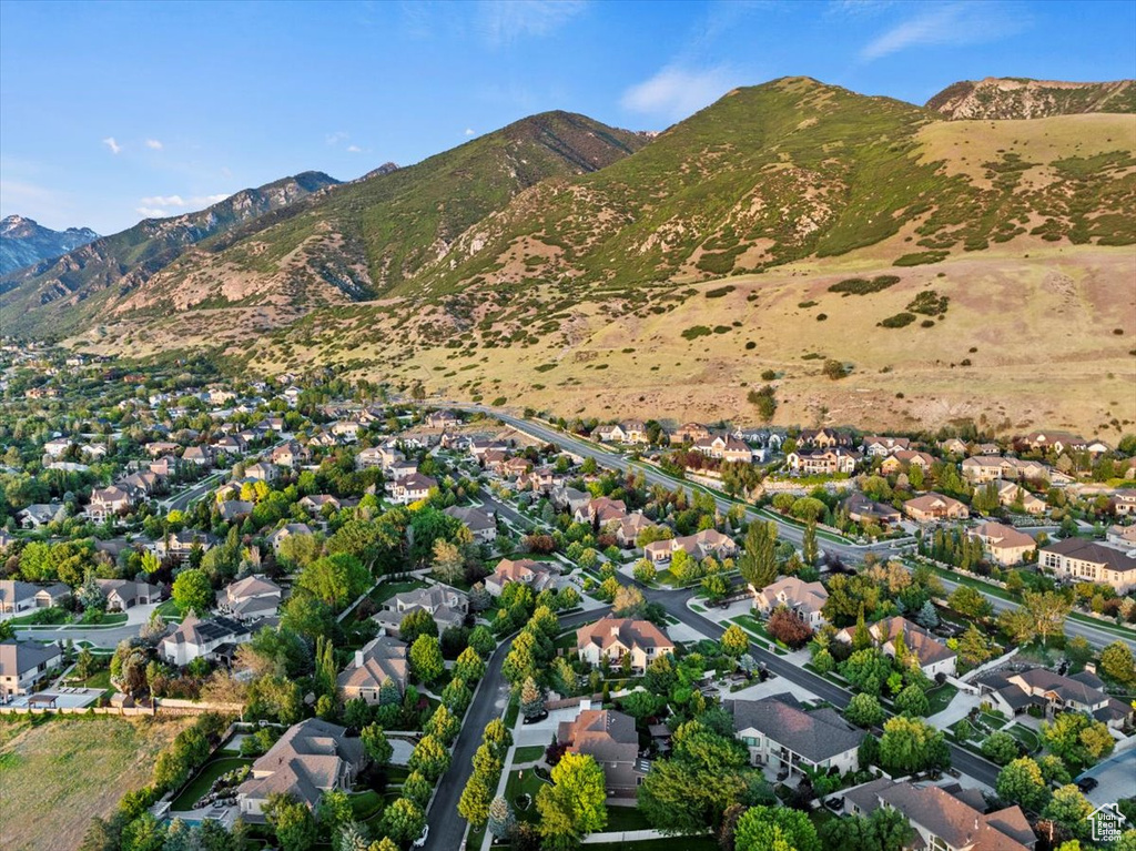 View of property location featuring a mountain backdrop and nearby suburban area