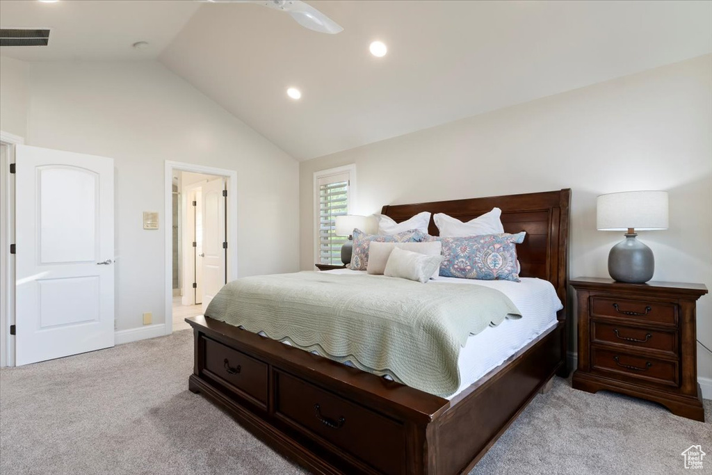 Bedroom with light carpet, lofted ceiling, recessed lighting, and baseboards