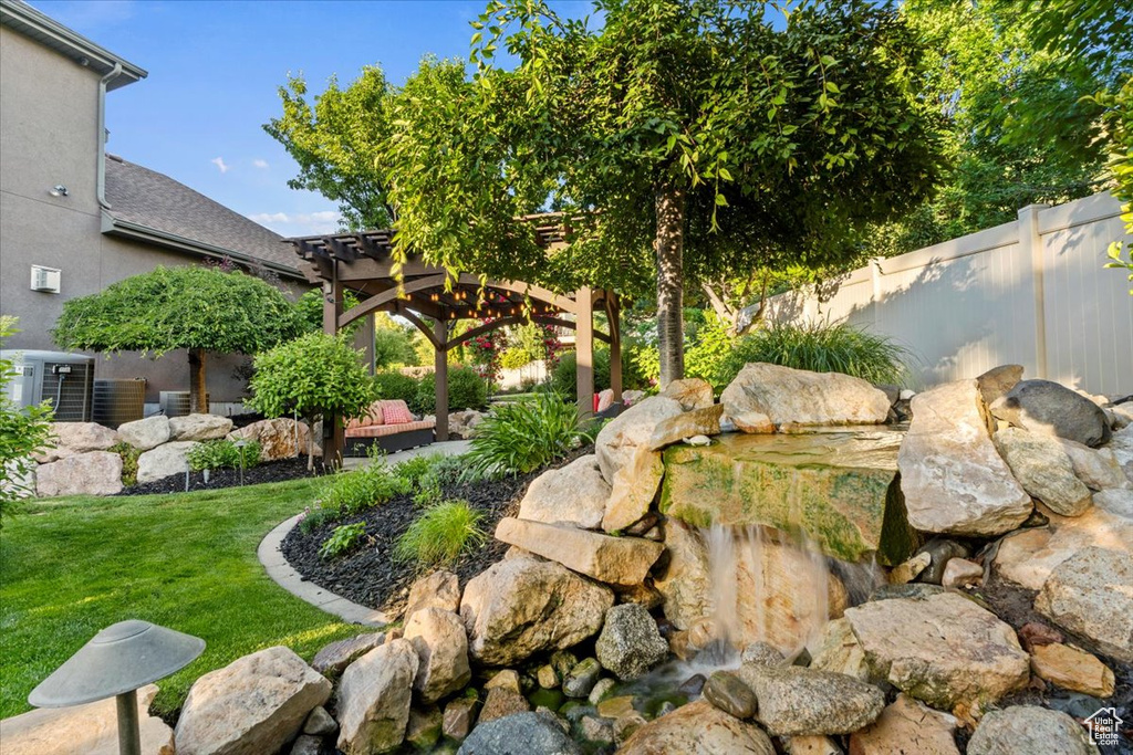 View of yard featuring a pergola