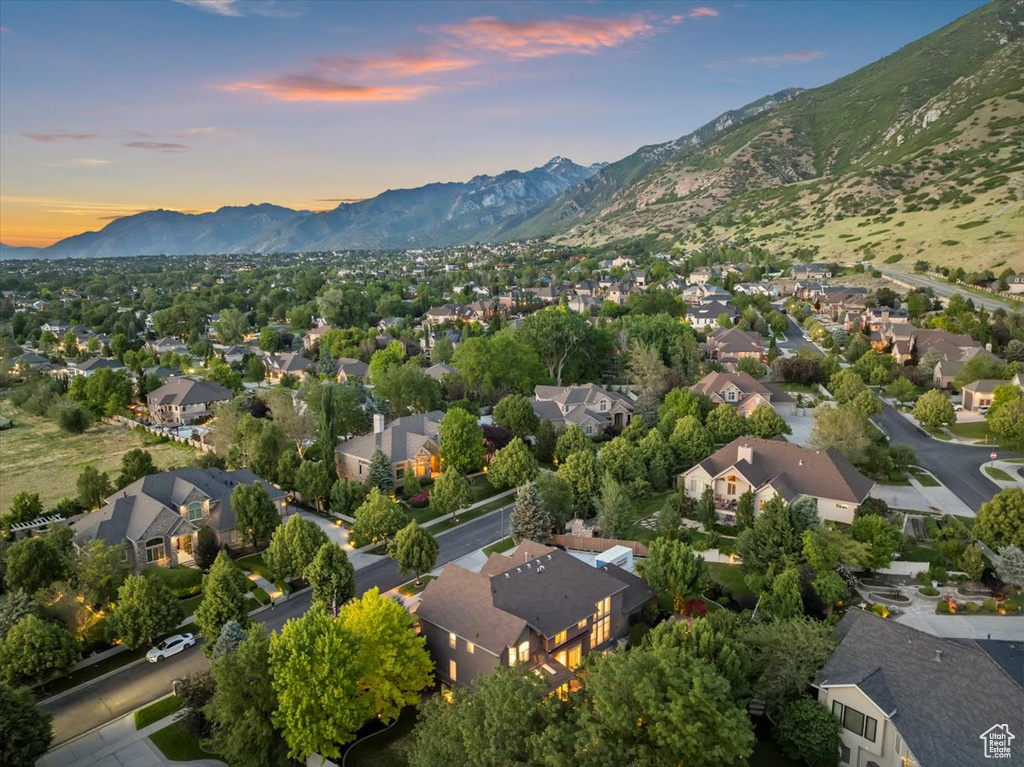 Aerial perspective of suburban area featuring a mountainous background