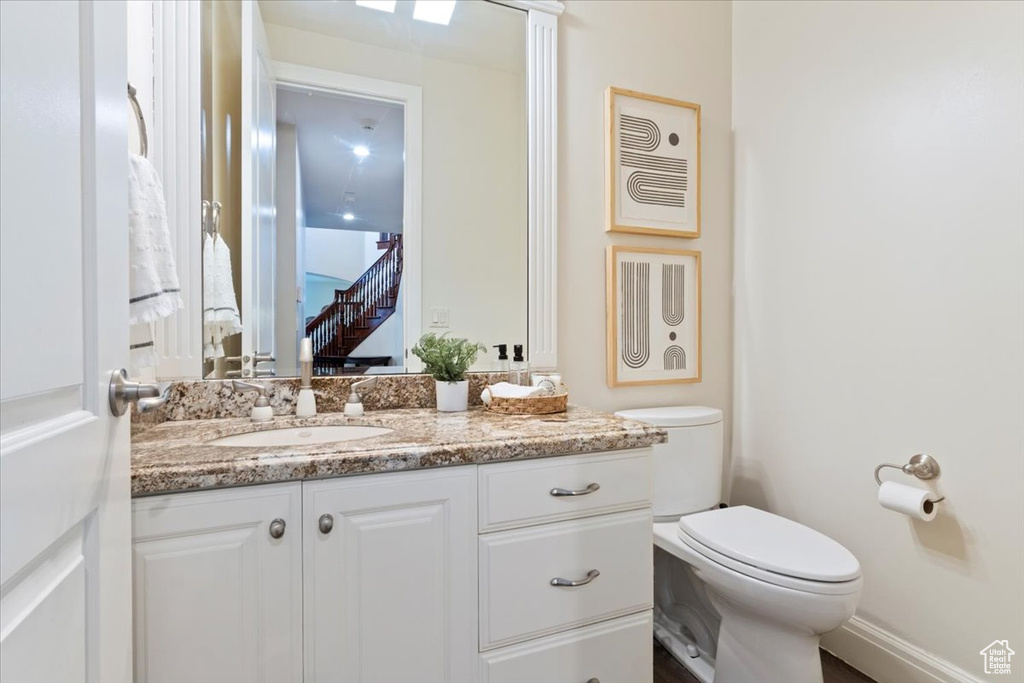 Bathroom featuring vanity and toilet
