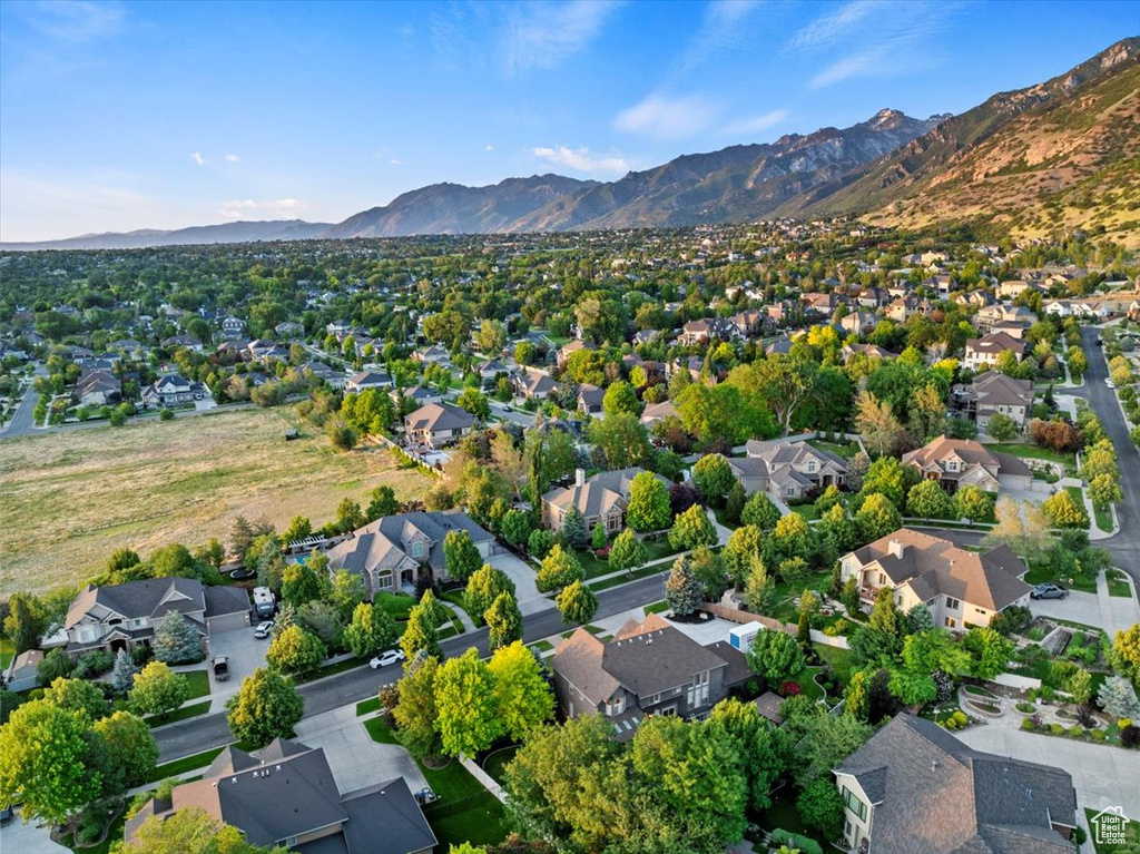 Aerial perspective of suburban area featuring a mountainous background