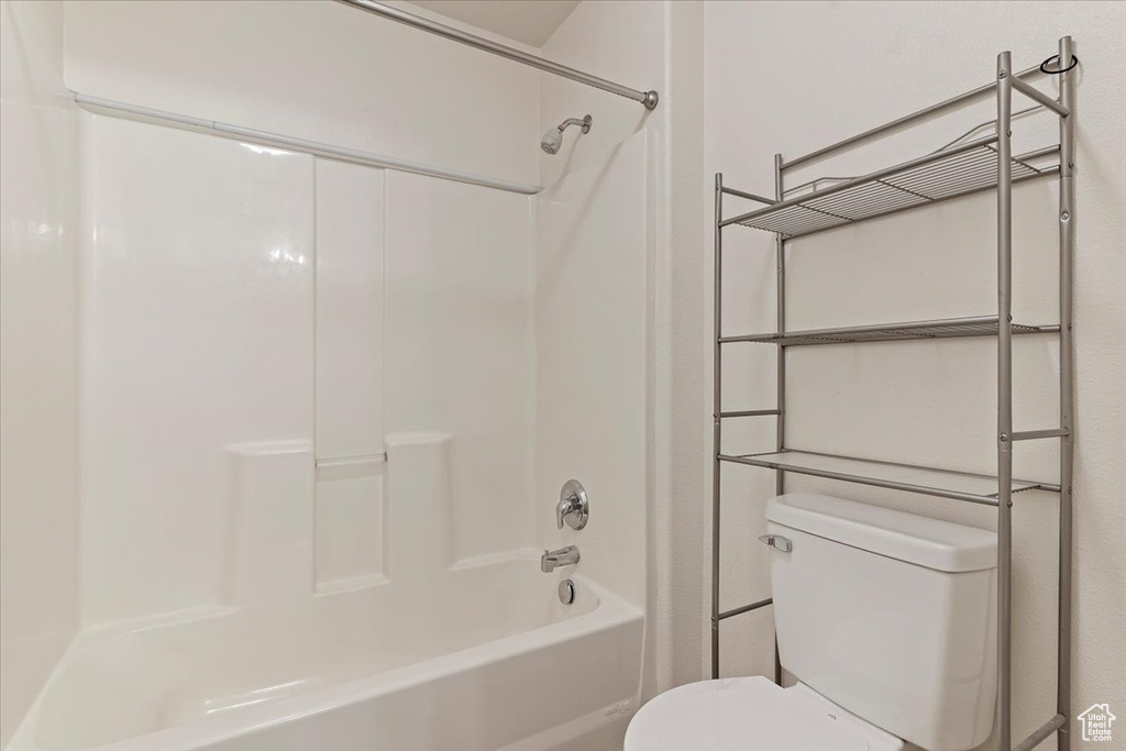 Bathroom with toilet and shower / bath combination
