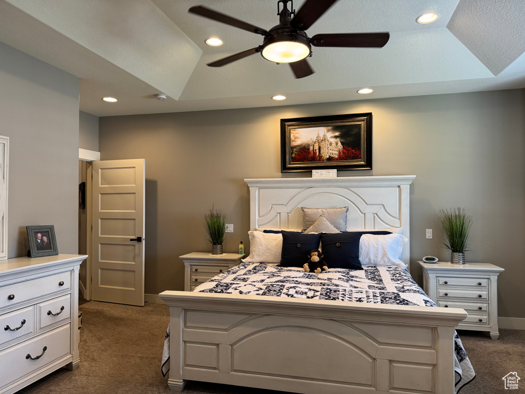 Bedroom with dark carpet, recessed lighting, baseboards, and a ceiling fan